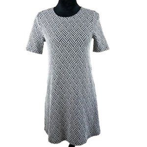Divided back zip dress. Charcoal and cream pattern. Short sleeves. Size 6